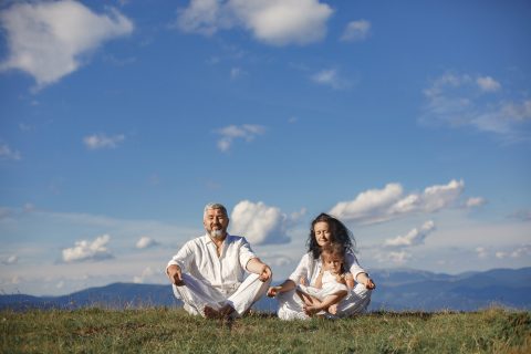 grandparents meditating with children