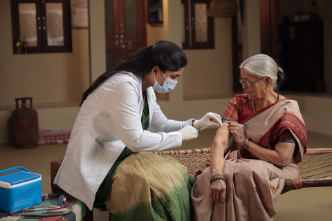 An older woman getting the shingles vaccine.